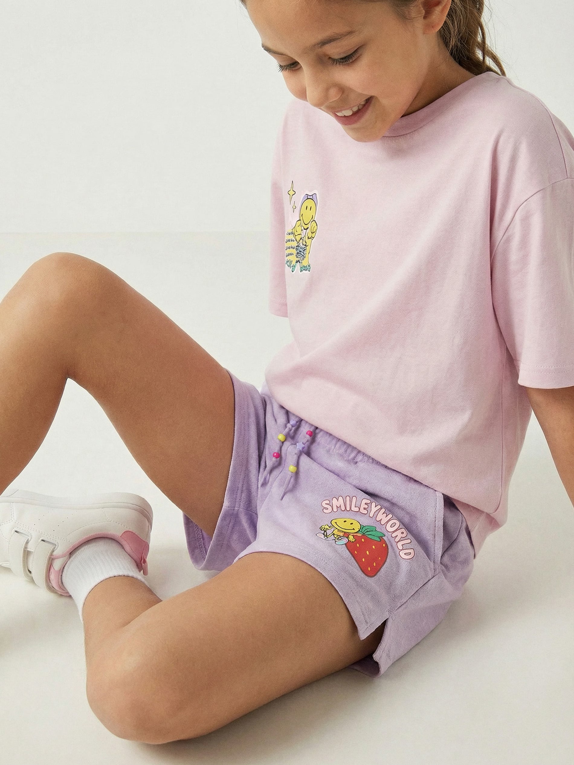 SmileyWorld® printed sweat shorts with decorative tie detail