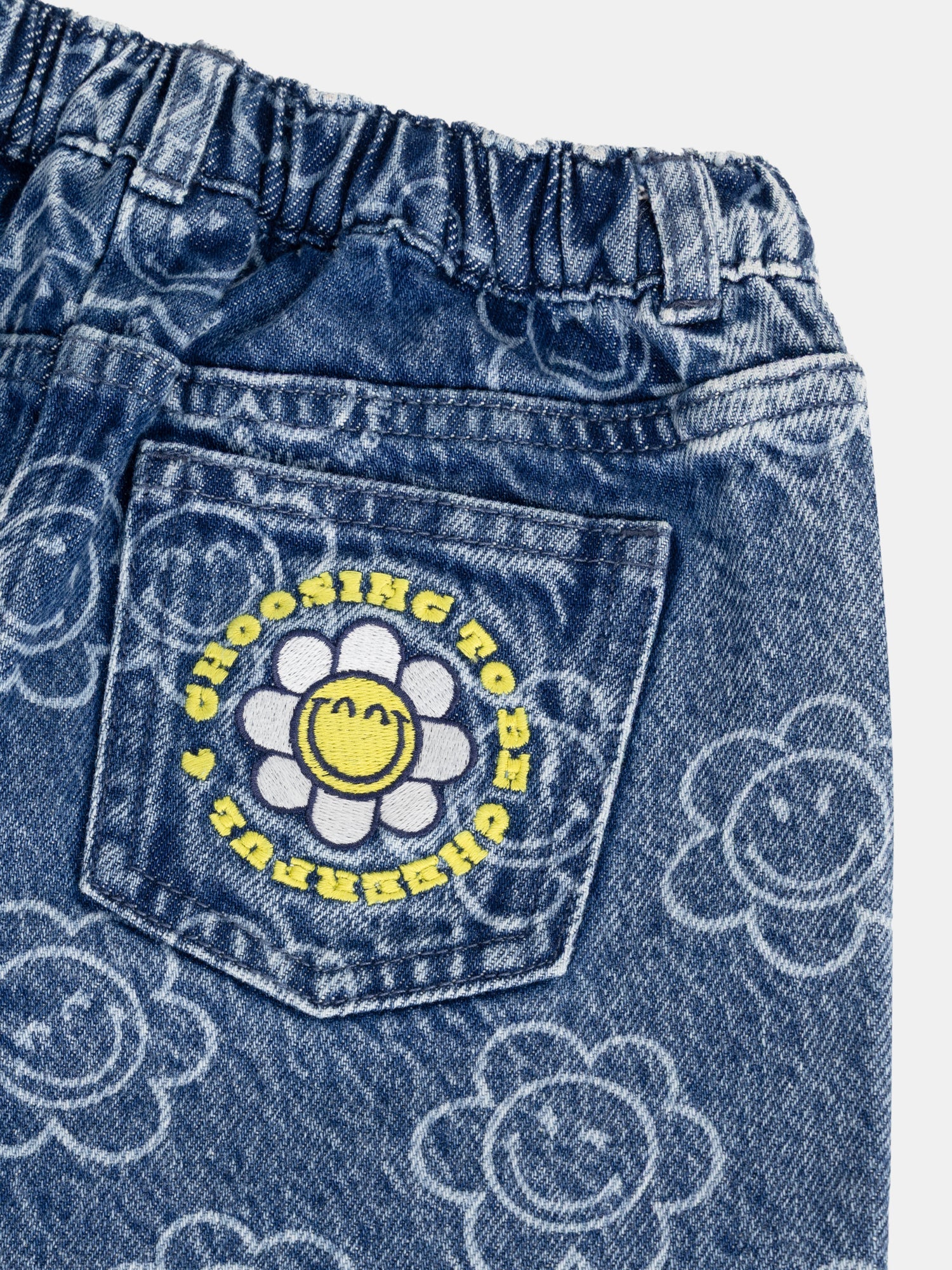 Blue jeans with SMILEYWORLD® flower print for girls