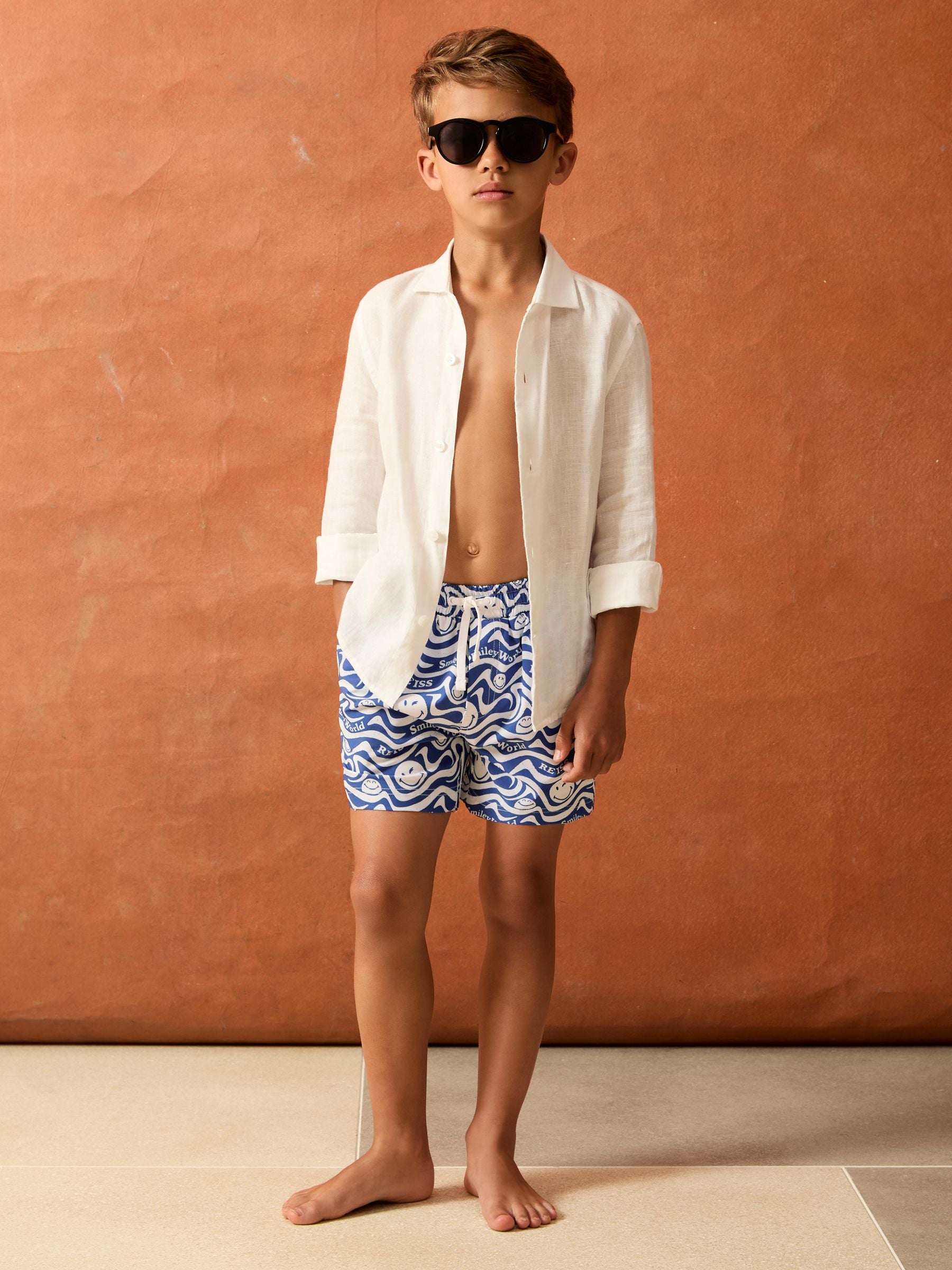 SmileyWorld | Reiss Wave Swim Shorts in Bright Blue